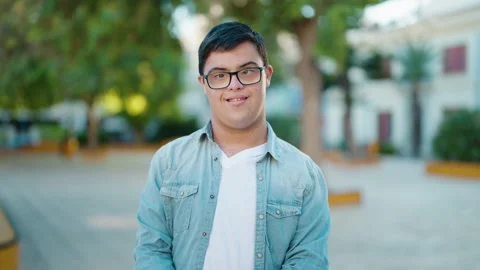 Down syndrome man smiling confident standing with arms crossed gesture at par Stock-Footage 170090848