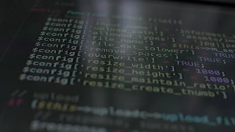 Down top shot of programming source code on black screen. Code written by Stock Footage 139450444