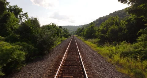 Down train tracks along the Hudson River in New York Stock Footage 346374555
