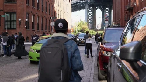 Down under the Manhattan Bridge Dumbo. Tourist hotspot many people taking photos Stock Footage 147000420