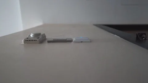 Down view hand holding key card insert box card for open and close system room Stock Footage 122881156