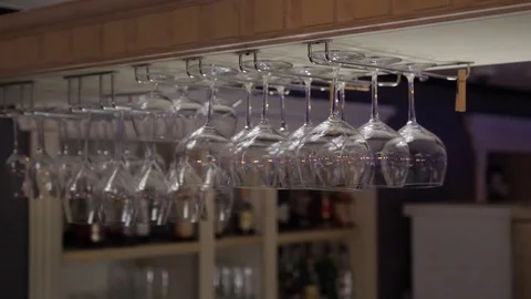 Down view of hanging wine glasses - 4k Stock Footage