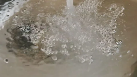 A down view of a kitchen sink filling up. Stock Footage 89327506