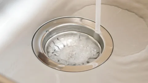A down view of a kitchen sink filling up. Stock Footage 90031310