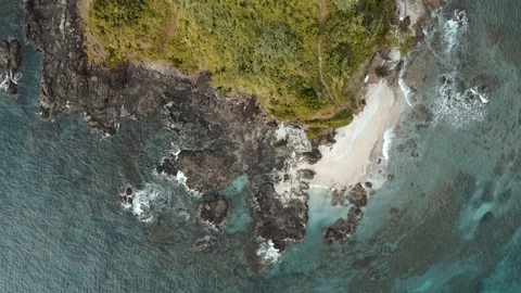 Down view of a lonely green island by drone Stock Footage 103454680