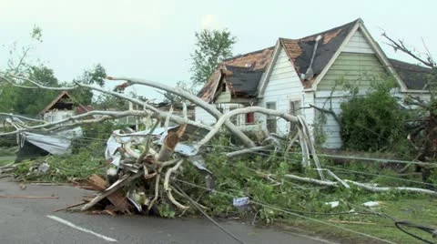 Downed power lines and damaged homes from a tornado Stock Footage 12577609
