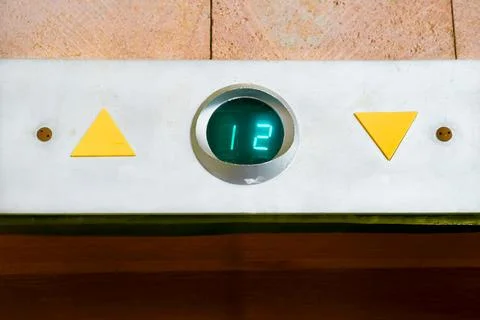 Up down.Elevator movement indicator board for floors in the building entrance Stock Photos