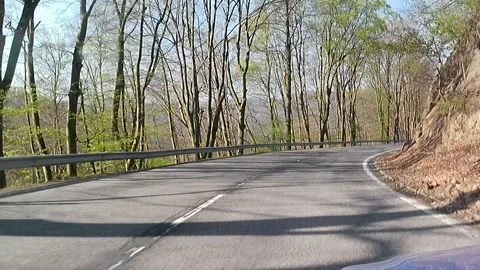 Downhill early spring ride video on mountain pass Pezinska Baba, Slovakia 動画素材 334512415