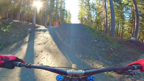 Downhill Mountain Biker doing Big Jumps in Schladming, Austria Stock Footage 220459094