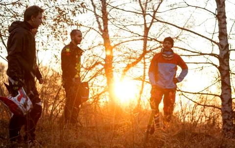 Downhill mountain bikers Stock Photos