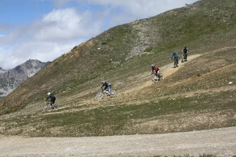 Downhill mountain bikers Stock Photos