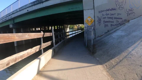 Downhill Path, Under bridge, water, waterfall, uphill Bike Path Outdoors Stock Footage 246939773