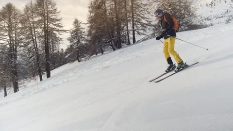 Downhill skiing. Camera tracking along fluently with skier. Stock Footage 156544066