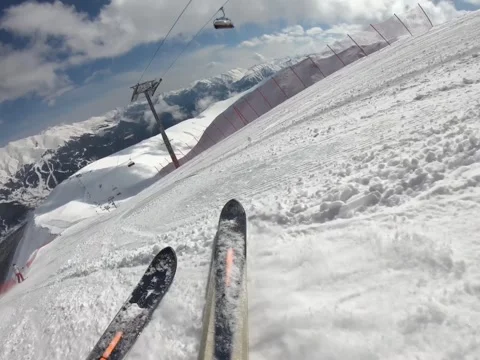Downhill skiing on white clear snow under blue sky Stock Footage 161752848