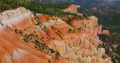 Downhill slopes and rock columns of beautiful canyons at daytime. Green forest Stock Footage 212976775