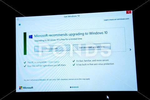 Download and upgrade latter button on Microsoft Windows screen Stock Photos