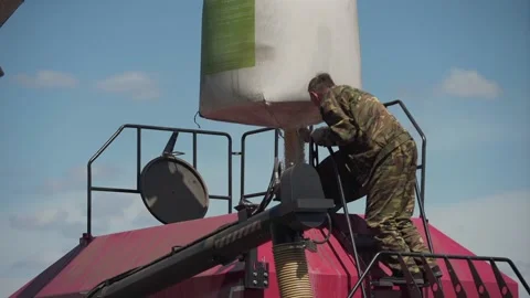 Download grain from bag into sowing complex Stock Footage 130299437