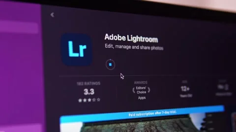 Downloading and installing Adobe Lightroom from the App Store on your MacBook. Video stock 202802662
