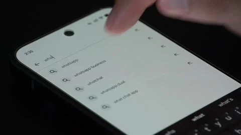 Downloading WhatsApp Messenger application on mobile phone, first use Stock Footage 340053397