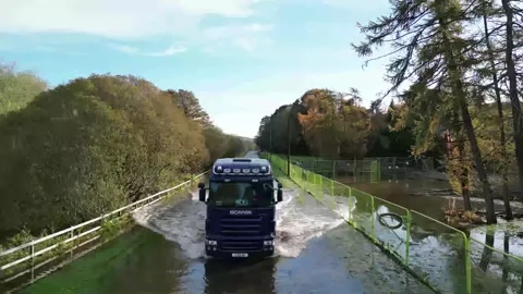Downpatrick, Quoile Road- Lorry driving through flood Stock Footage 255076466