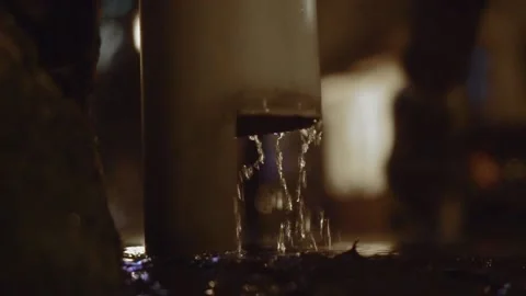 Downpipe, it's raining water splashes at night. Stock-Footage 163474494