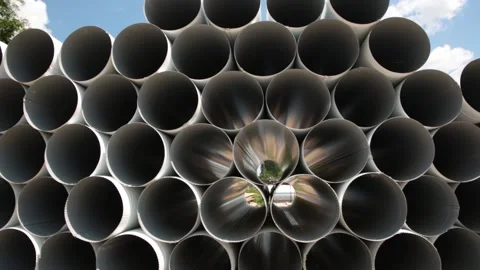 Downpipe warehouse. Stack of stainless steel pipes. Stock Footage 155683634