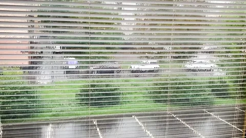 Downpour outside the window with blinds Stock Footage 313931292