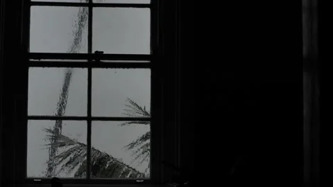 Downpour through a window in blacked out room 4K Video stock 274427383