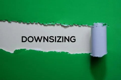 Downsizing Text written in torn paper 写真素材