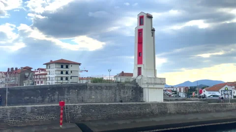 Downstream port alignment lighthouse in the port of Saint-Jean-de-Luz, France Stock Footage 250611370