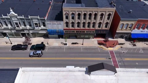 Downtown Adrian, Michigan developing urban scene with historic storefronts in Stock Footage 327604961