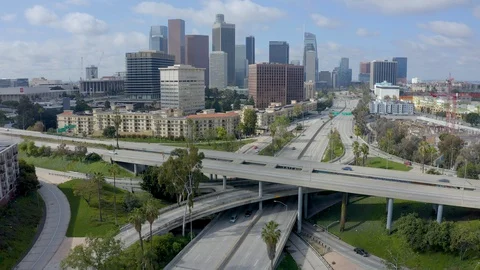 Downtown Aerial view of light freeway traffic in Los Angeles during Coronavirus Stock Footage 128225401