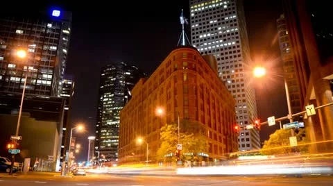 Downtown big city block with looping traffic at night Video stock 11703077