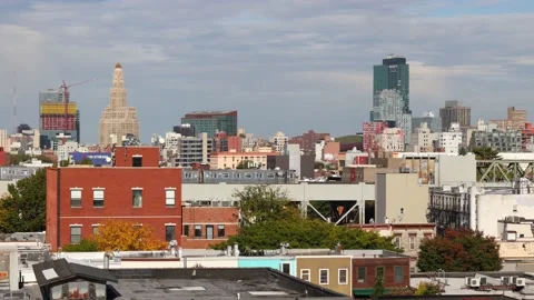 Downtown Brooklyn Skyline Cityscape with elevated subway train passing through Video stock 219439390
