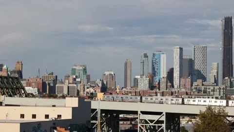 Downtown Brooklyn Skyline with elevated subway train passing through Video stock 219439373