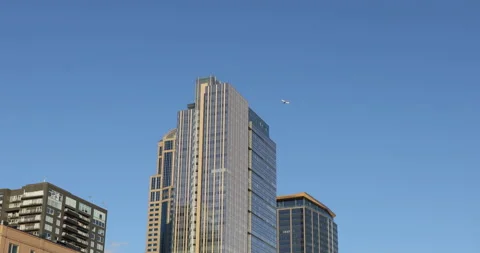 Downtown Building with Plane flyby Stock Footage 165247539