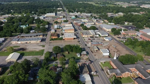 Downtown buildings and a highway intersection, Madisonville, Texas, USA Stock Footage 129207929