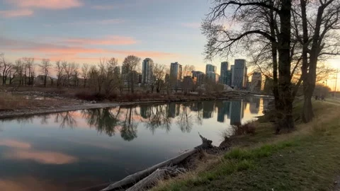 Downtown Calgary Skyline Reflected in River at Sunset – Horizontal Video stock 308434598