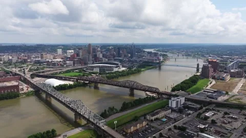Downtown Cincinnati, Ohio River and landmark bridges under clouds Stock Footage 345739899