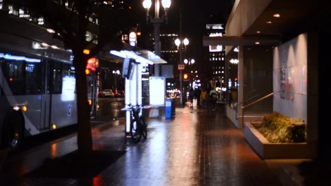 Downtown City bus - static shot wet night cold Stock Footage 101566408