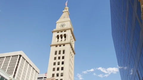 Downtown denver tilt down on Sears Clock tower summer blue sky RED 4K slowmotion Stock Footage 117781336