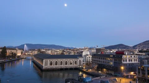 Downtown Geneva Lights Up from Seujet, Day to Night - Switzerland Timelapse 4K Stock Footage