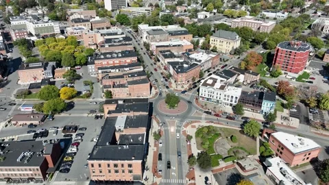 Downtown Glens Falls roundabout and historic buildings aerial, New York Stock Footage 347004091