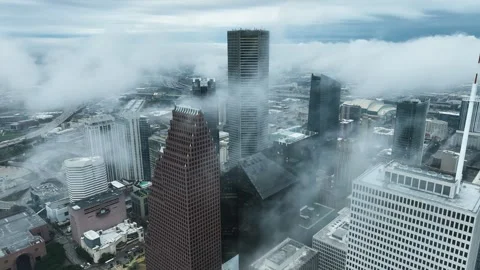 Downtown Houston Skyscrapers in Low Clouds from Orbiting Aerial Drone Vídeo Stock 346244396