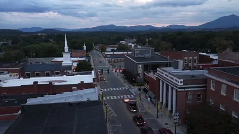 Downtown Intersection With Steeple and Distant Peak Stock Footage 347702833