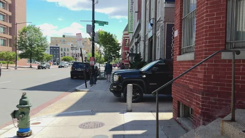 Downtown intersection with traffic and pedestrians Video stock 324614090