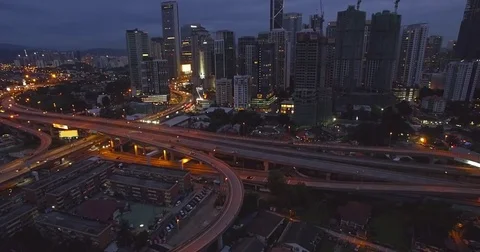 Downtown Kuala Lumpur and Freeway Intersection, Drone Shot and Camera Tilt Stock-Footage 80499859