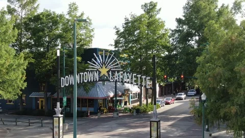 Downtown Lafayette gateway above a tree lined Louisiana street Stock-Footage 111683639