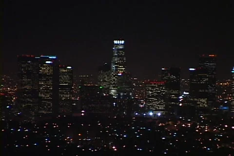 Downtown Los Angeles office buildings lights shine bright at night. Stock Footage