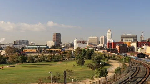 Downtown Los Angeles view with Skyscrapers, City Hall and Metro Rail Train Stock Footage
